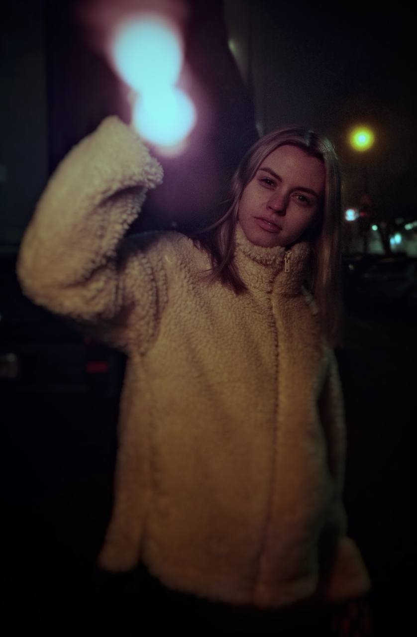 Night portrait lit by a hand-held light wand