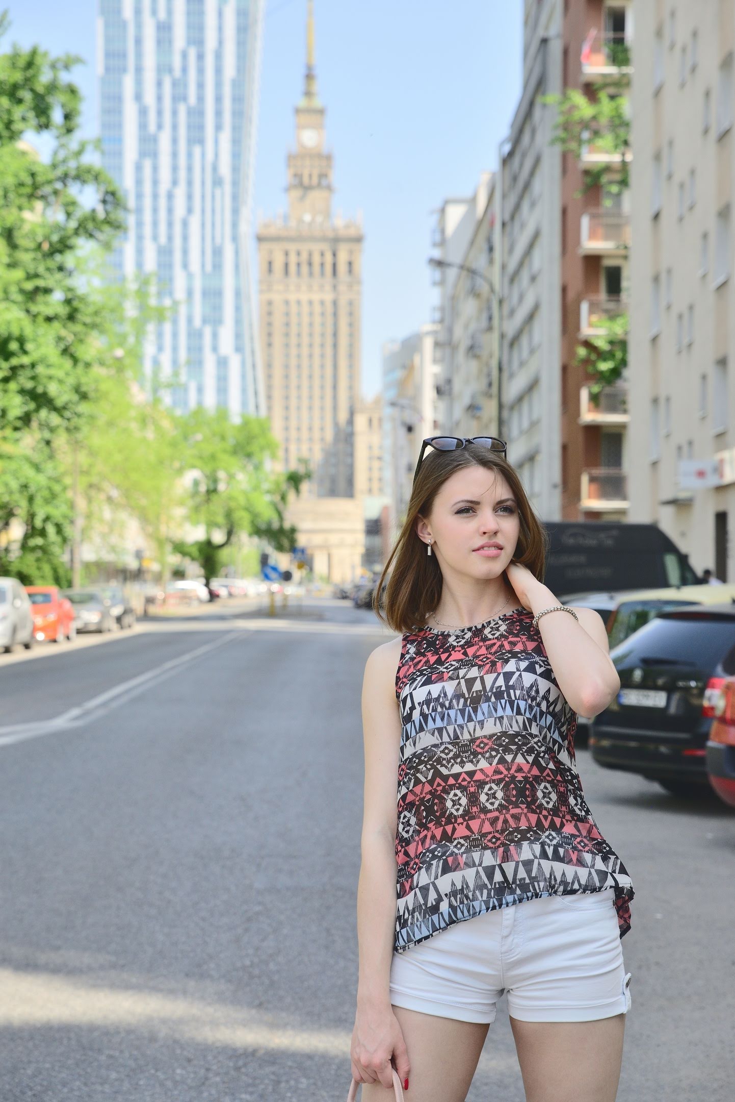 Warsaw street portrait — patterned top and white shorts